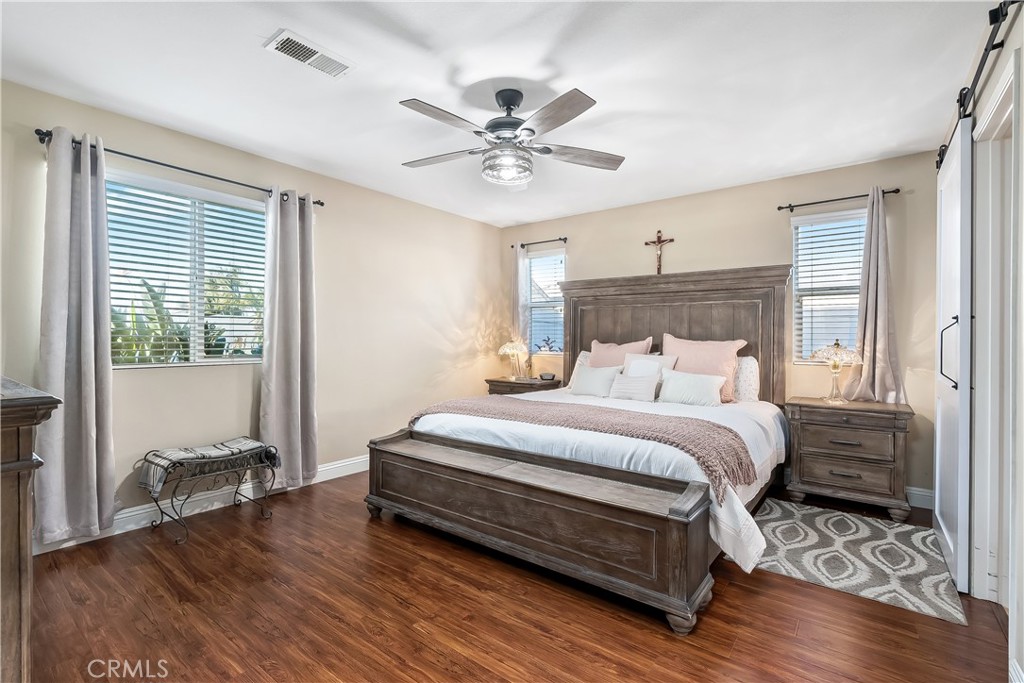 14428 Table Bluff Circle Eastvale, CA 92880 - Photo 22 of 29 a bedroom with bed and a window