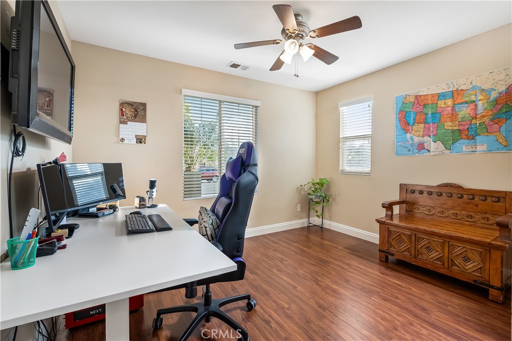 14428 Table Bluff Circle Eastvale, CA 92880 - Photo 24 of 29 a view of a workspace with furniture and a window