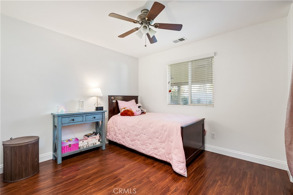 14428 Table Bluff Circle Eastvale, CA 92880 - Photo 26 of 29 a bedroom with a bed and a window