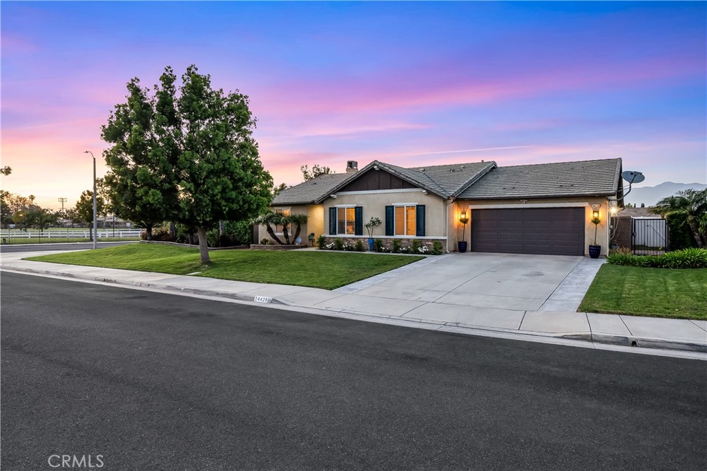 14428 Table Bluff Circle Eastvale, CA 92880 - Photo 3 of 29 a front view of a house with a yard and garage