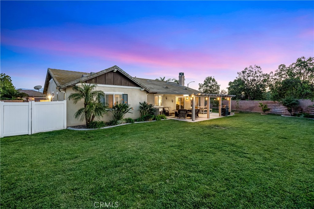 14428 Table Bluff Circle Eastvale, CA 92880 - Photo 5 of 29 a front view of a house with garden