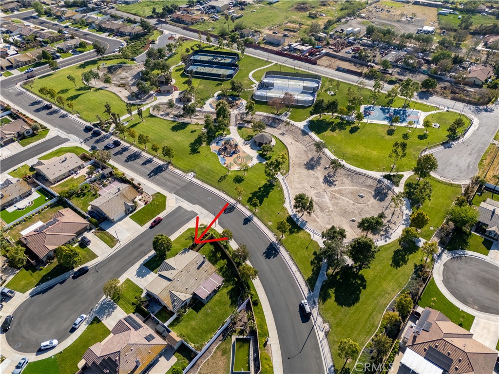 14428 Table Bluff Circle Eastvale, CA 92880 - Photo 9 of 29 an aerial view of a swimming pool yard and mountain view in back