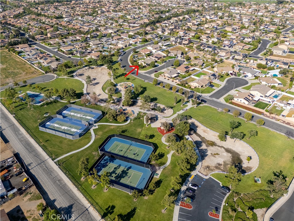 14428 Table Bluff Circle Eastvale, CA 92880 - Photo 10 of 29 an aerial view of a residential houses with yard
