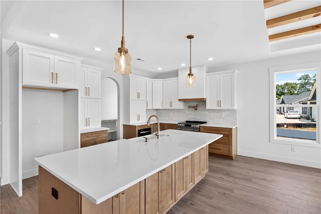 424 Blume Road Anderson, SC 29625 - Photo 11 of 30 Culinary dreams come alive in this well-appointed kitchen featuring a substantial island and gleaming countertops.