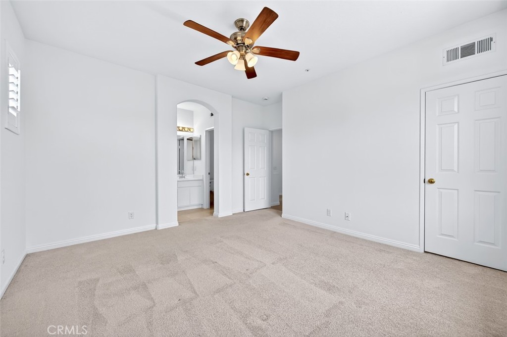 447 Ridgeway Irvine, CA 92620 - Photo 44 of 88 an empty room with closet and a ceiling fan