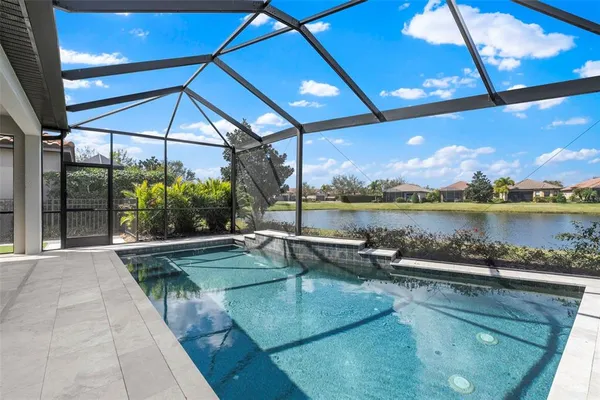 a view of a swimming pool with a patio