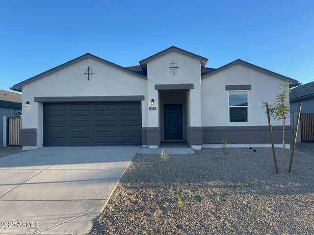 a front view of a house with garage