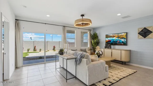 a living room with fireplace furniture and a flat screen tv