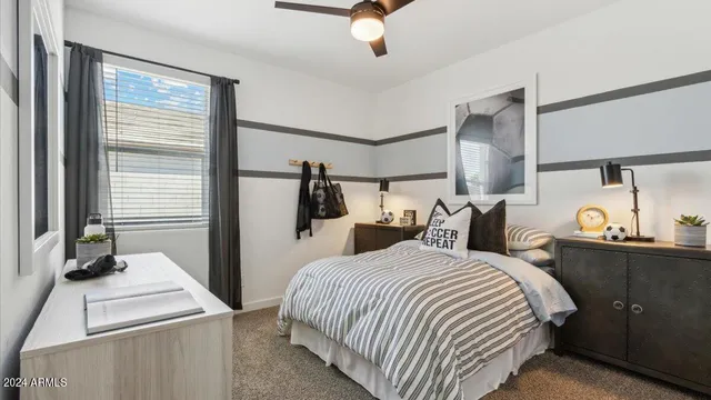 a bedroom with bed and window