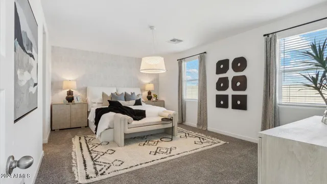 a living room with furniture a rug and a window