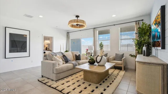 a living room with furniture and a large window
