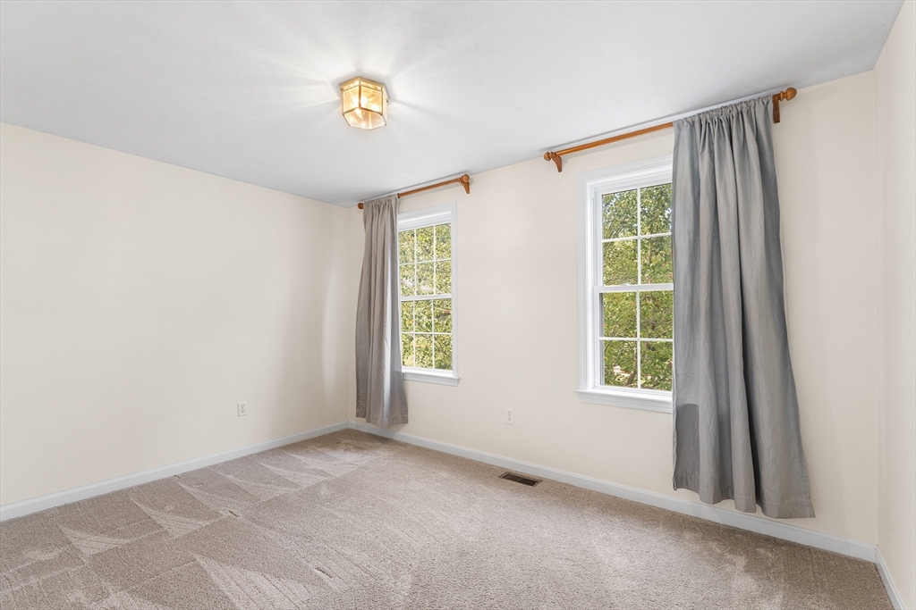 70 Loring Avenue Boxborough, MA 01719 - Photo 15 of 33 a view of an empty room with a window