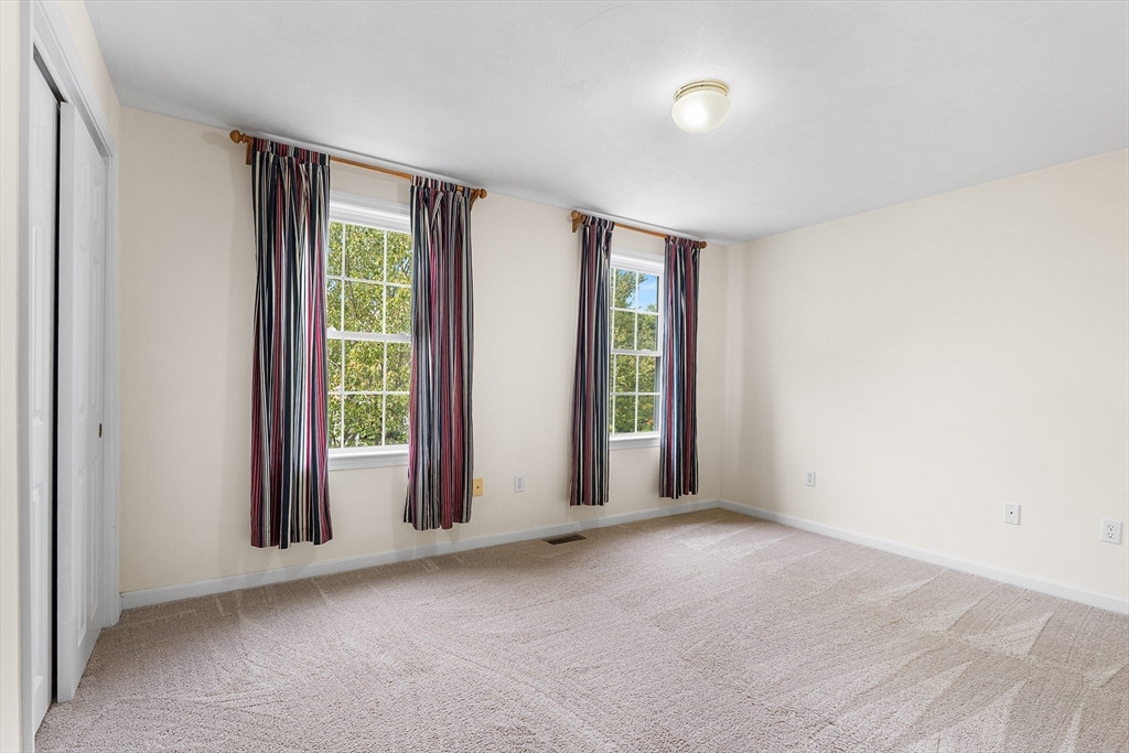 70 Loring Avenue Boxborough, MA 01719 - Photo 19 of 33 an empty room with windows and closet