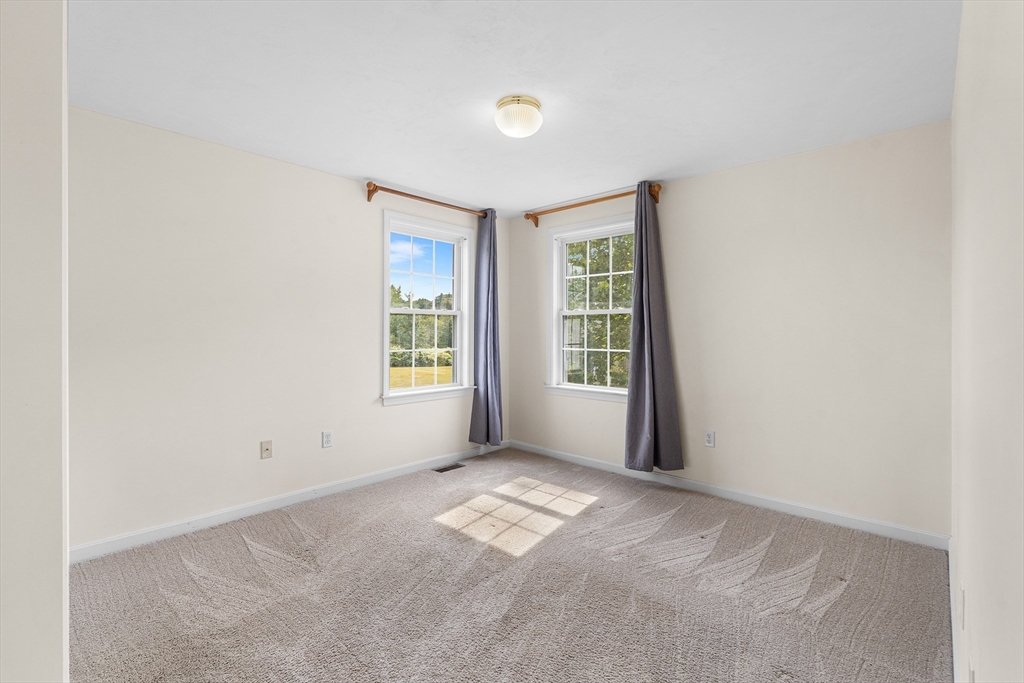 70 Loring Avenue Boxborough, MA 01719 - Photo 21 of 33 an empty room with windows