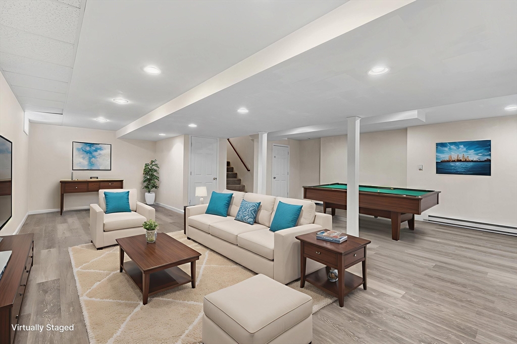 70 Loring Avenue Boxborough, MA 01719 - Photo 24 of 33 a living room with furniture and a wooden floor