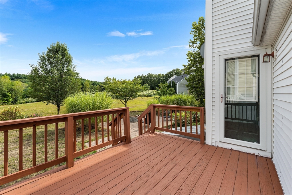 70 Loring Avenue Boxborough, MA 01719 - Photo 27 of 33 a balcony with wooden floor and outdoor seating