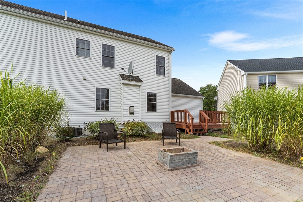 70 Loring Avenue Boxborough, MA 01719 - Photo 28 of 33 a front view of a house with garden