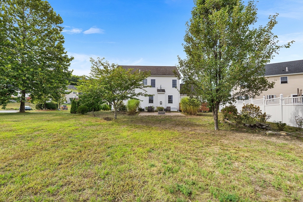70 Loring Avenue Boxborough, MA 01719 - Photo 30 of 33 a backyard of a house with table and chairs