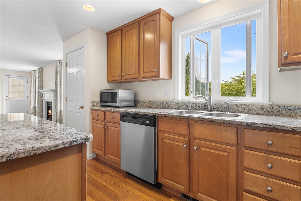 70 Loring Avenue Boxborough, MA 01719 - Photo 5 of 33 a kitchen with granite countertop cabinets sink and window
