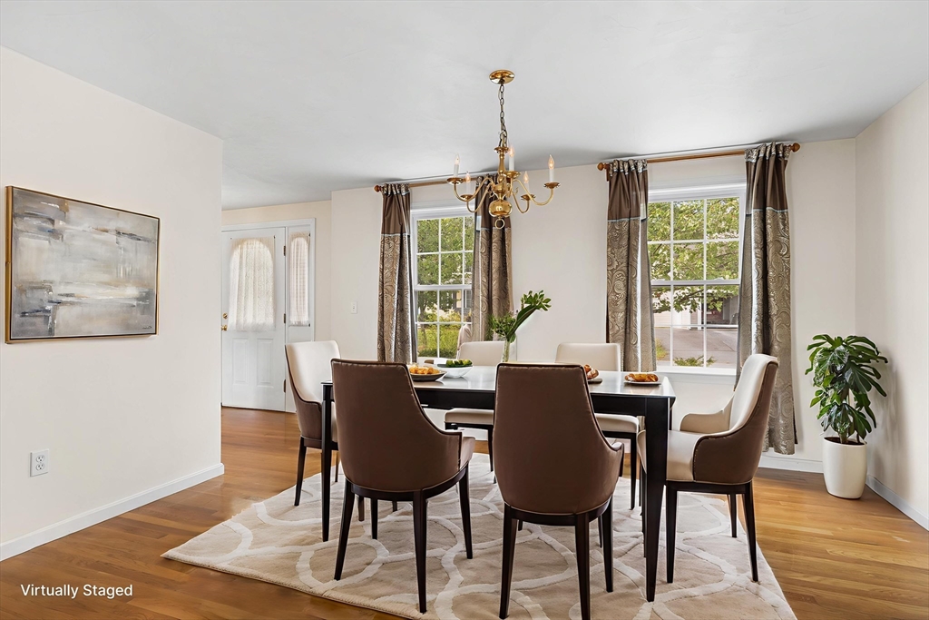 70 Loring Avenue Boxborough, MA 01719 - Photo 10 of 33 a view of a dining room with furniture window and wooden floor