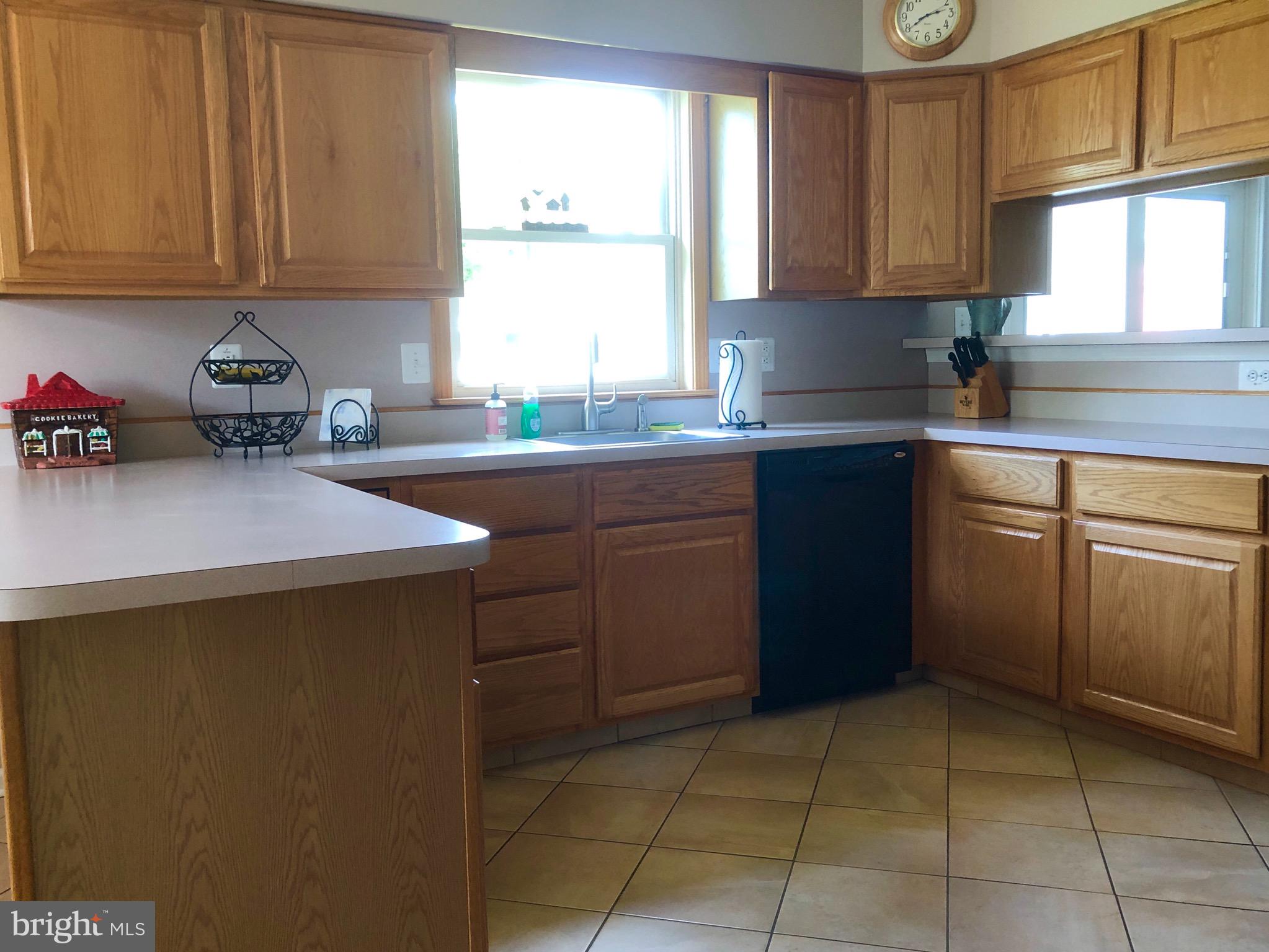 4 Rockingham Drive Marlton, NJ 08053 - Photo 16 of 46 a kitchen with a sink window and cabinets