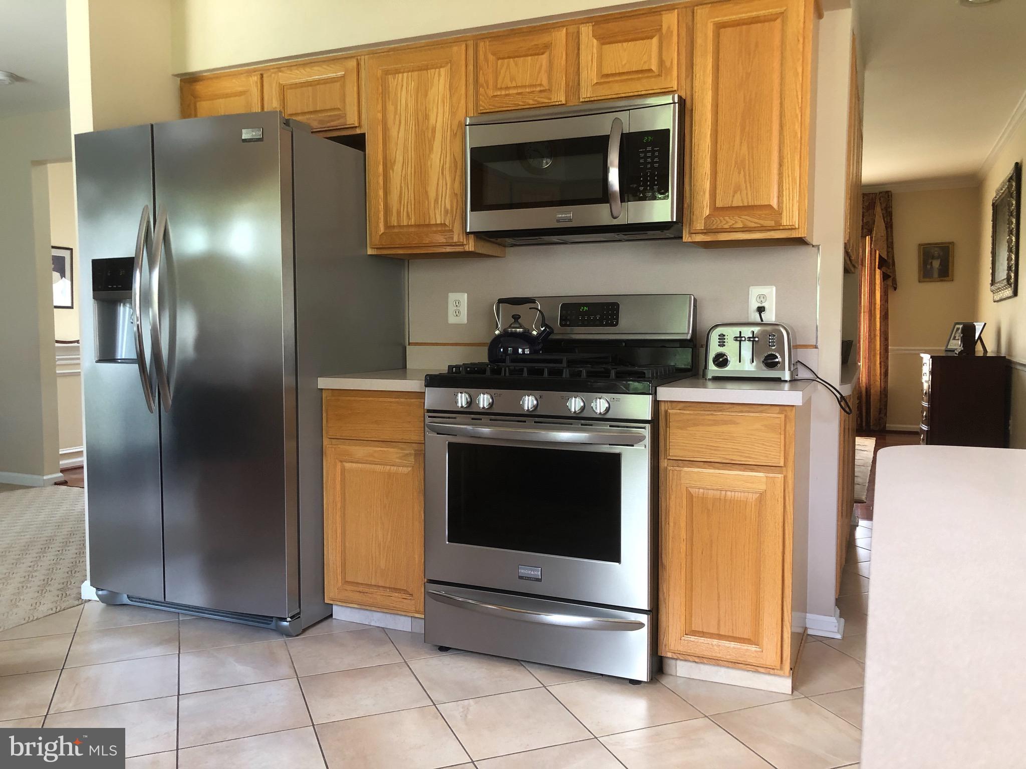 4 Rockingham Drive Marlton, NJ 08053 - Photo 17 of 46 a kitchen with stainless steel appliances granite countertop a stove and a refrigerator