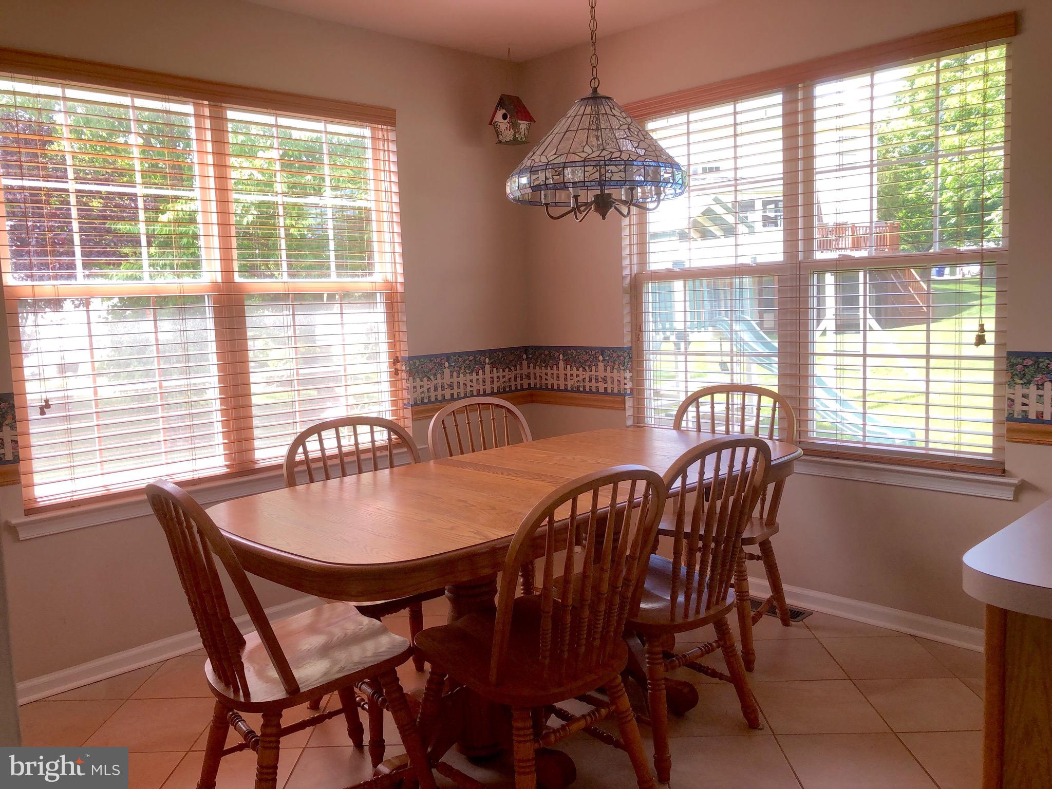 4 Rockingham Drive Marlton, NJ 08053 - Photo 19 of 46 a dining room with furniture a chandelier and wooden floor