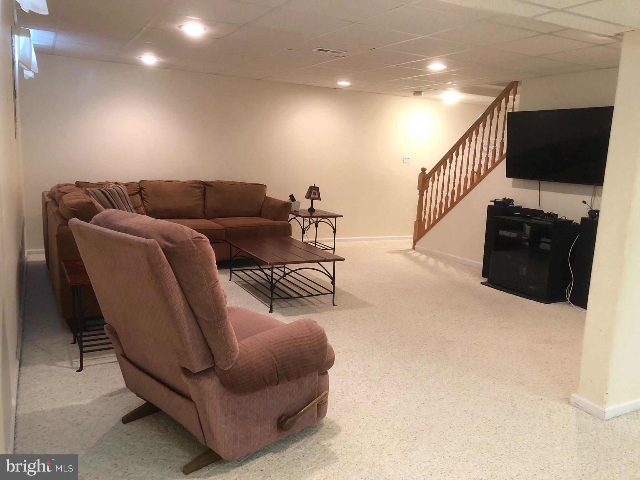4 Rockingham Drive Marlton, NJ 08053 - Photo 38 of 46 a living room with furniture and a flat screen tv