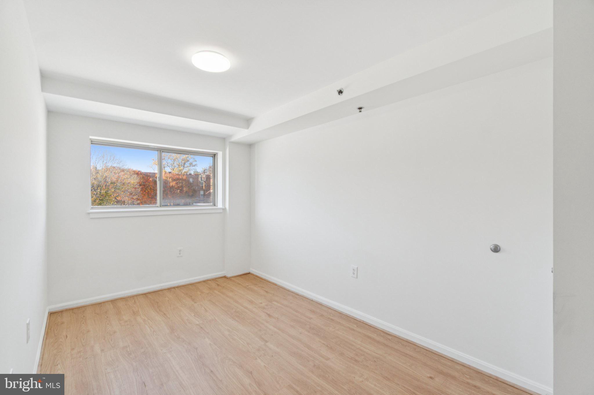 7981 Eastern Avenue Northwest, Unit 204 Silver Spring, MD 20910 - Photo 14 of 32 Primary Bedroom