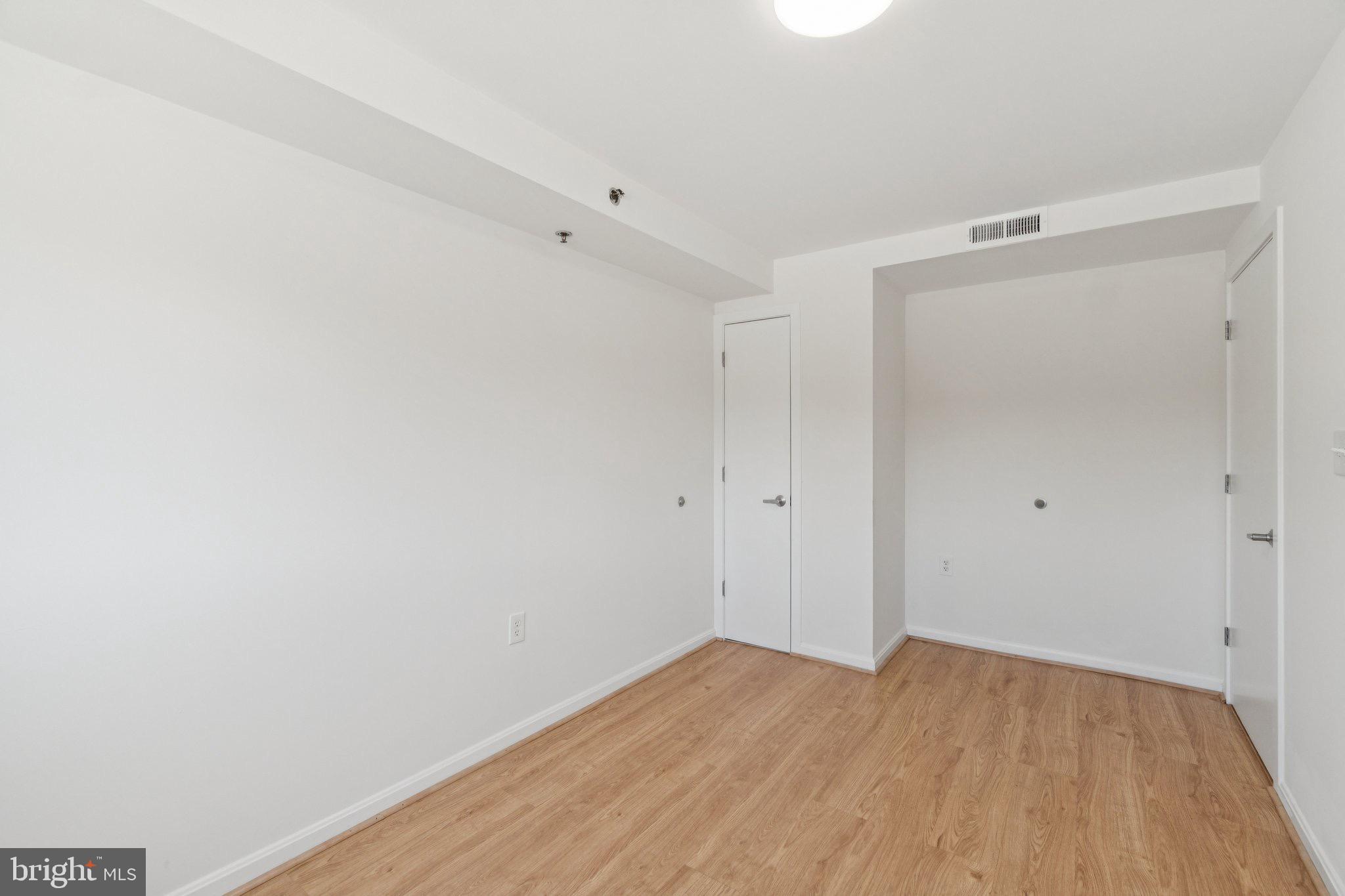 7981 Eastern Avenue Northwest, Unit 204 Silver Spring, MD 20910 - Photo 15 of 32 Primary Bedroom