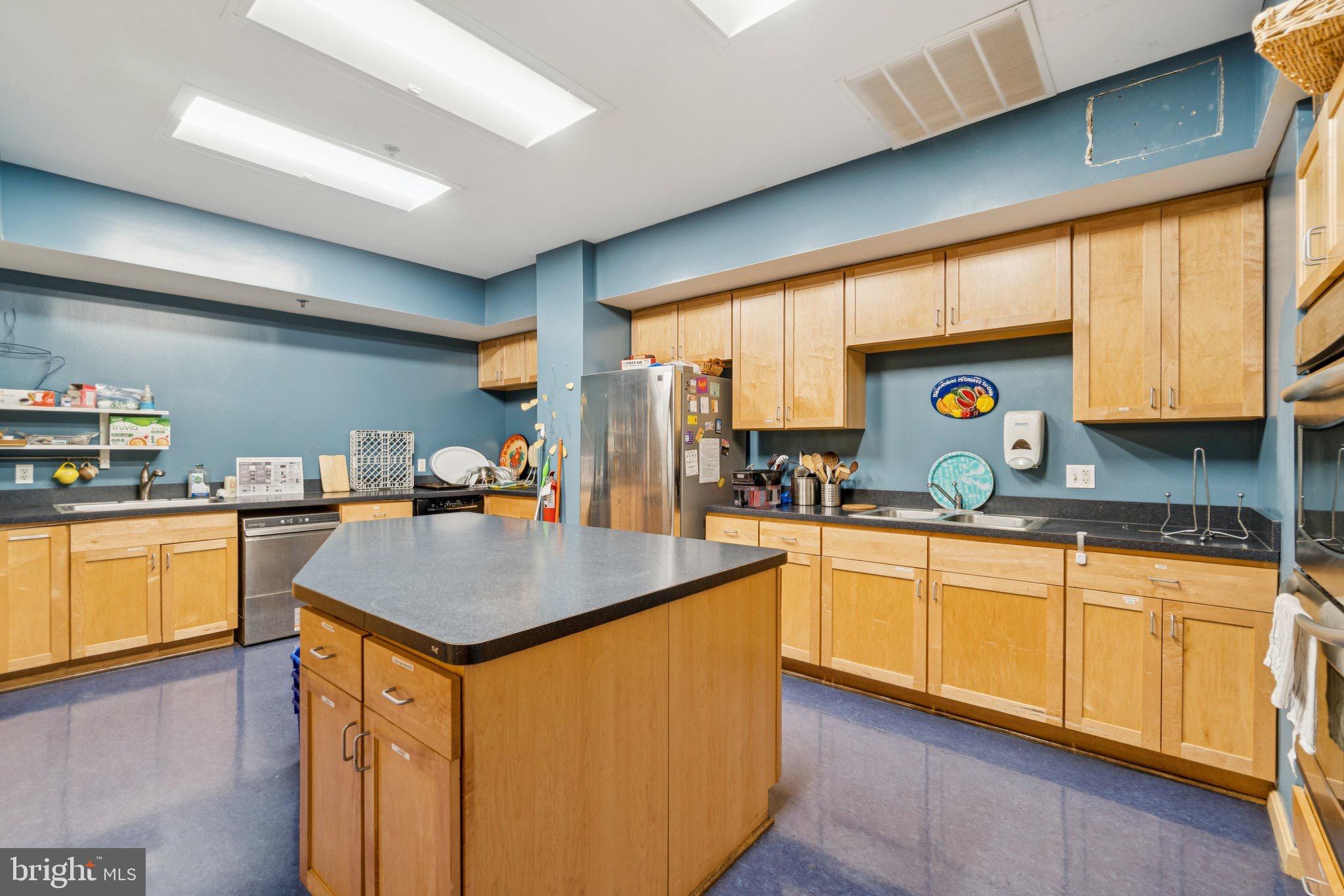 7981 Eastern Avenue Northwest, Unit 204 Silver Spring, MD 20910 - Photo 24 of 32 Shared spacious kitchen with kitchen gadgets