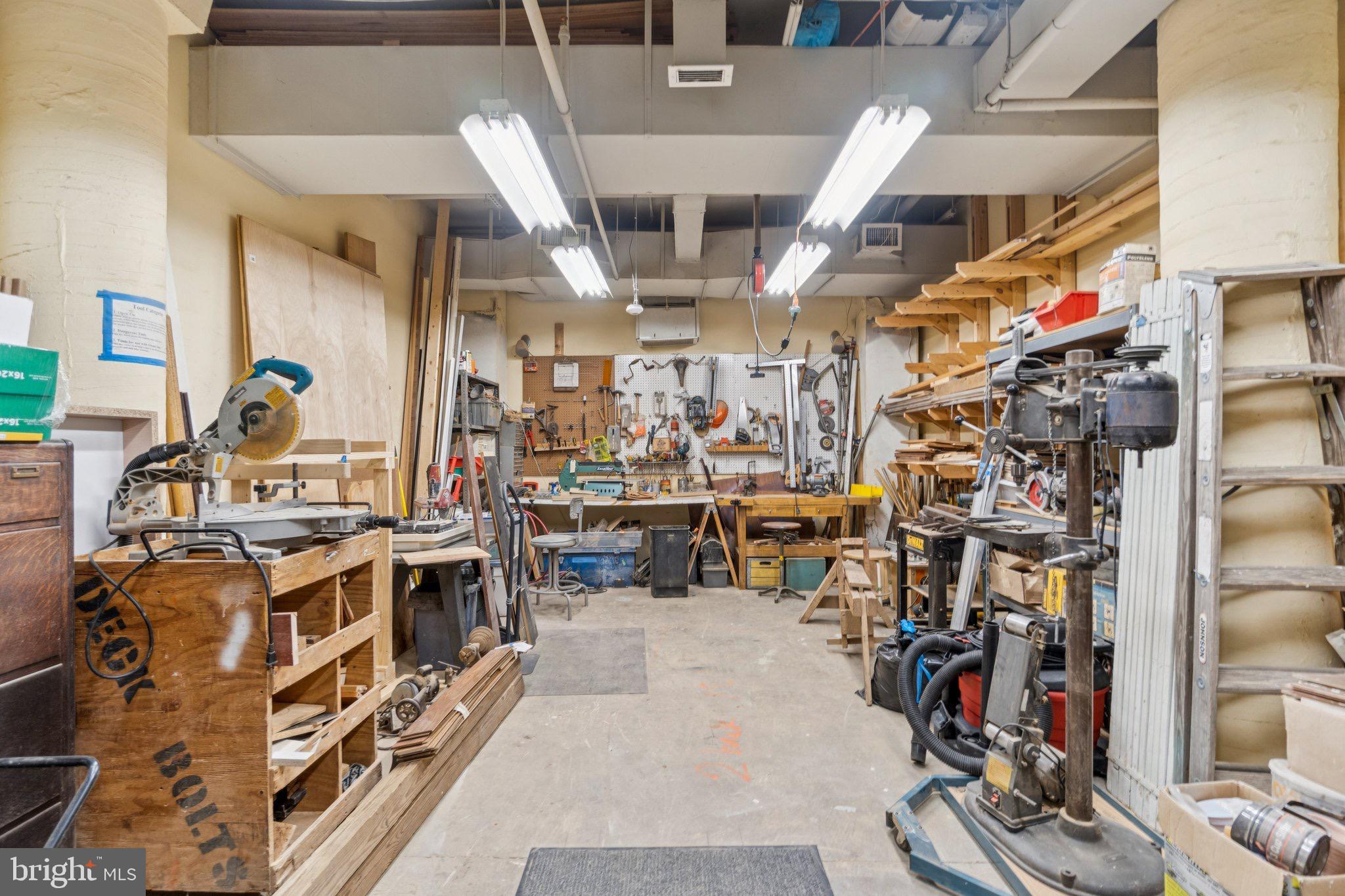 7981 Eastern Avenue Northwest, Unit 204 Silver Spring, MD 20910 - Photo 28 of 32 Wood/tool/craft workshop with tools and materials.
