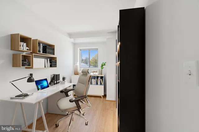 a view of a workspace with furniture and toys