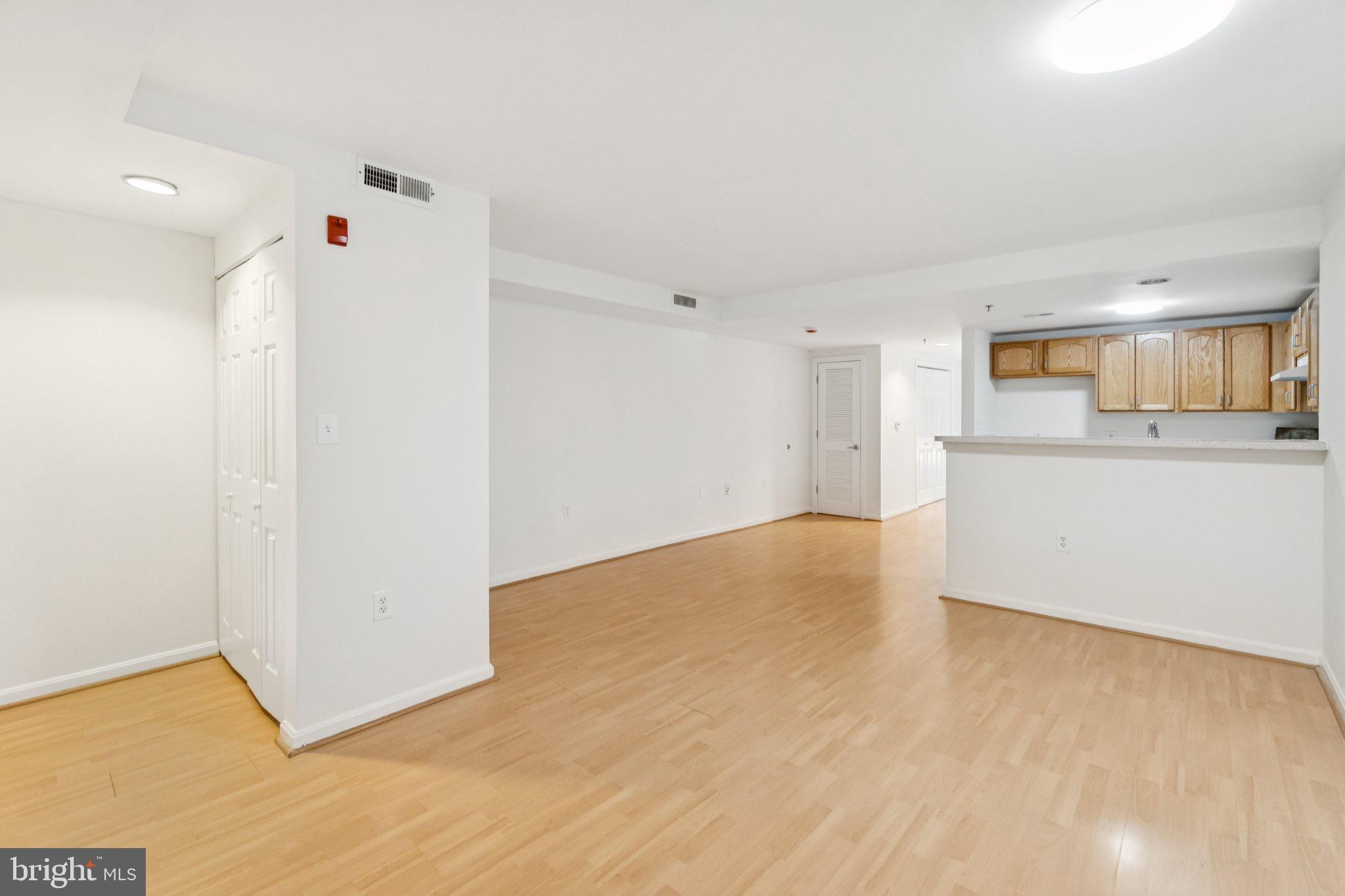7981 Eastern Avenue Northwest, Unit 204 Silver Spring, MD 20910 - Photo 8 of 32 Living-Dining-Kitchen Rooms