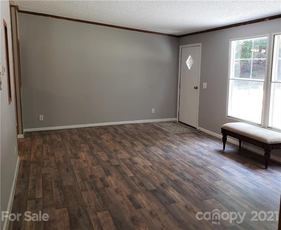 2012 State Rd S-46-168 York, SC 29745 - Photo 12 of 48 an empty room with wooden floor and a window