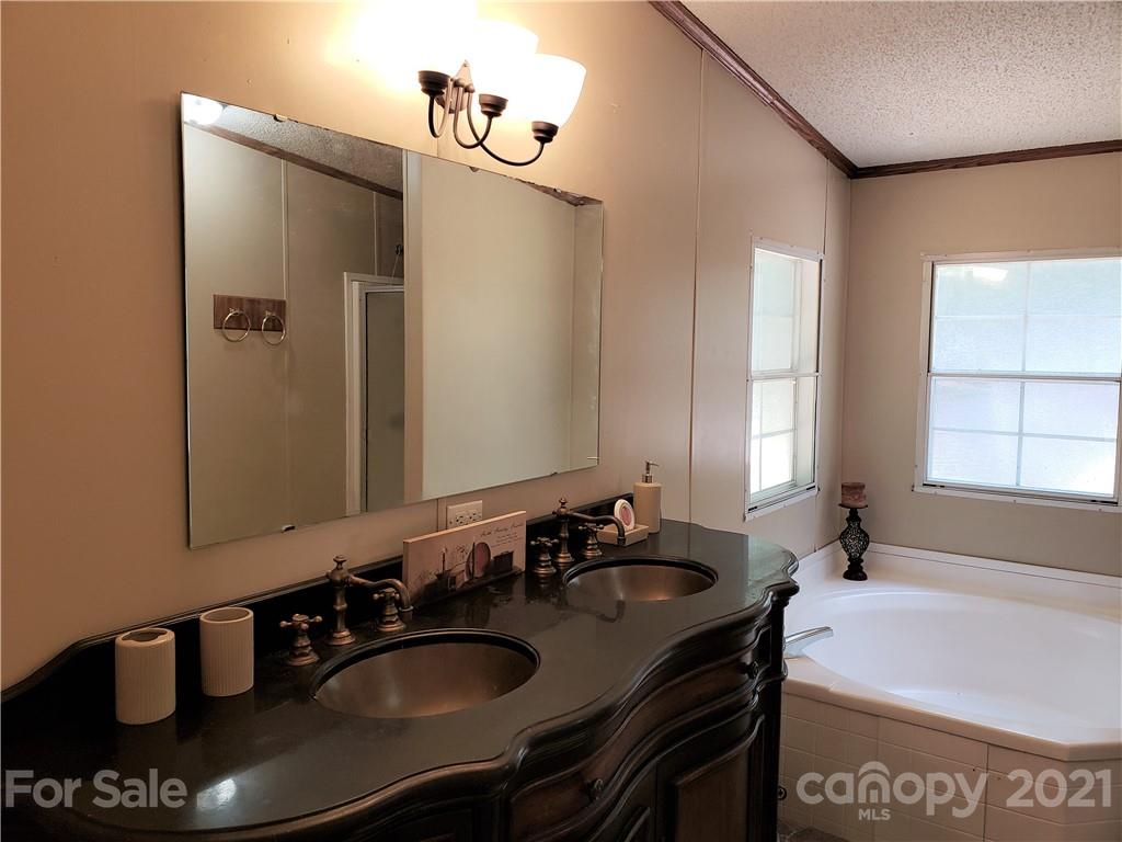 2012 State Rd S-46-168 York, SC 29745 - Photo 16 of 48 a bathroom with a sink double vanity and a mirror