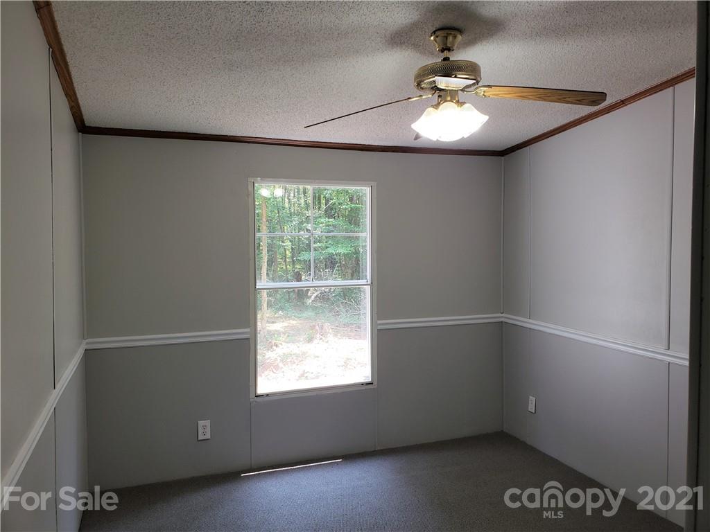 2012 State Rd S-46-168 York, SC 29745 - Photo 19 of 48 an empty room with windows and ceiling fan