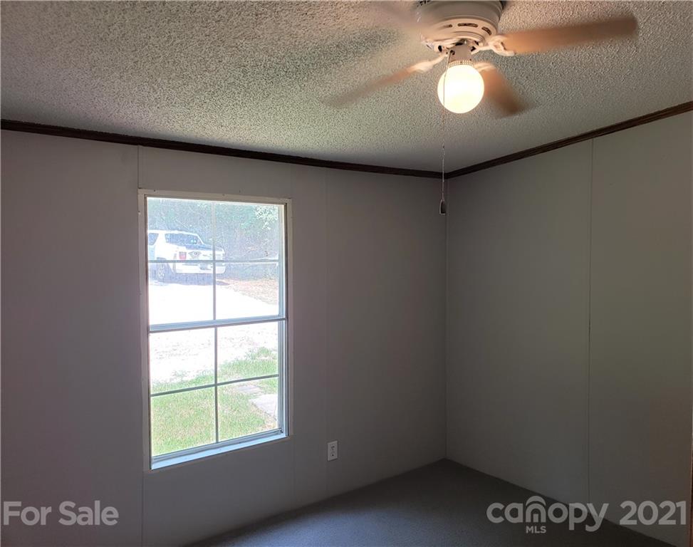 2012 State Rd S-46-168 York, SC 29745 - Photo 22 of 48 an empty room with windows and fan