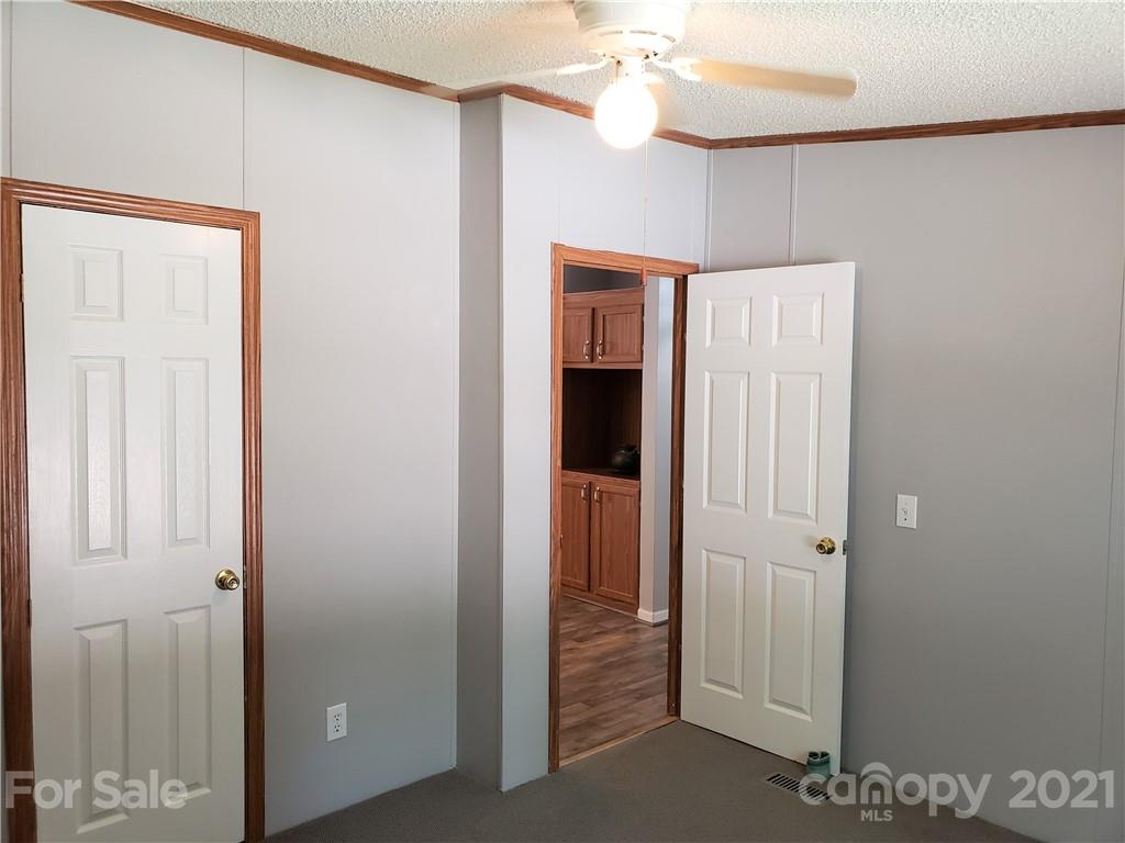 2012 State Rd S-46-168 York, SC 29745 - Photo 23 of 48 a view of a hallway with a chandelier fan