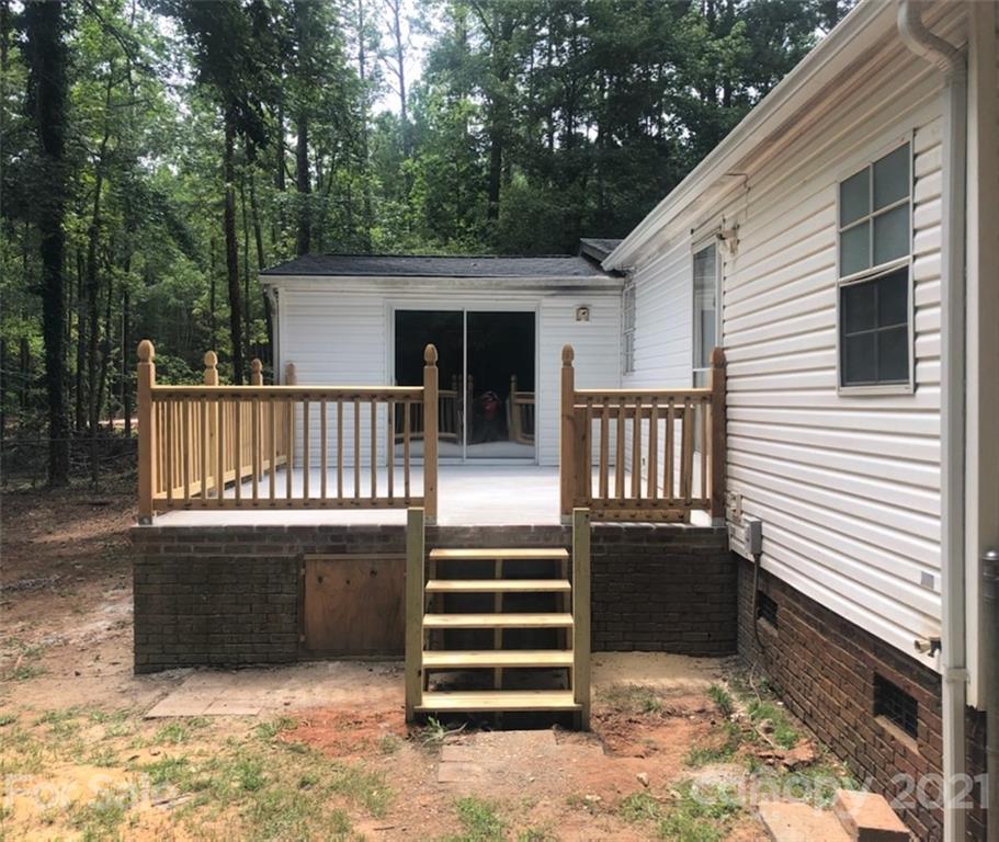 2012 State Rd S-46-168 York, SC 29745 - Photo 34 of 48 a view of a deck with a chair and floor to ceiling window