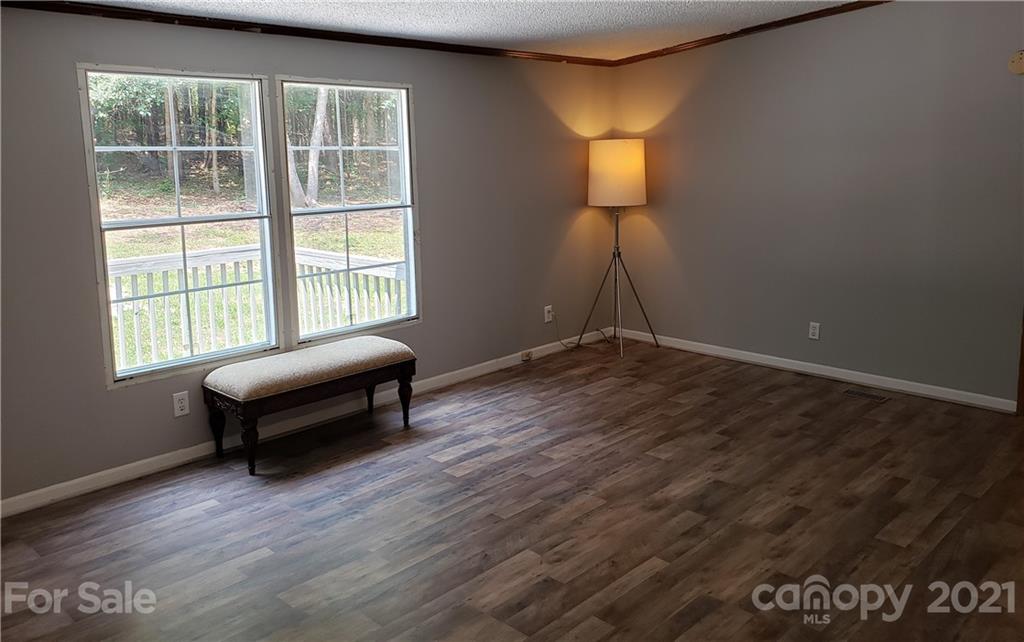 2012 State Rd S-46-168 York, SC 29745 - Photo 10 of 48 an empty room with windows and wooden floor
