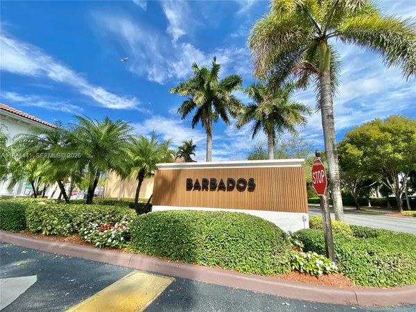 a sign that is sitting in front of a house