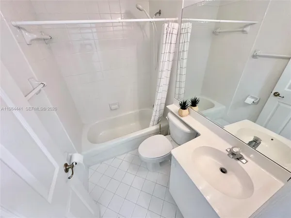 a bathroom with a sink a toilet and a bathtub
