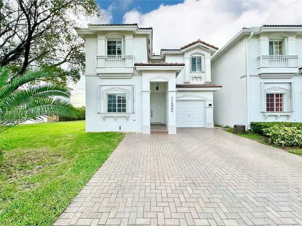 front view of a house with a yard