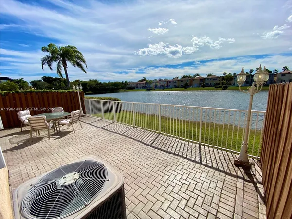 a view of balcony with furniture