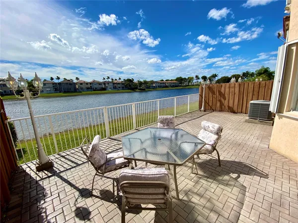 a view of a balcony with furniture
