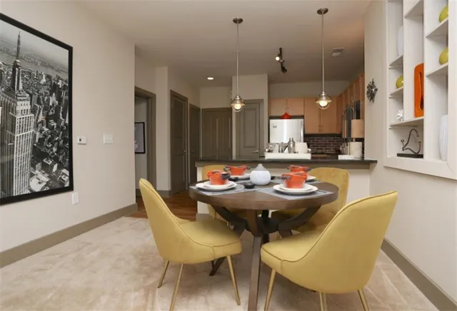 a view of a dining room with furniture