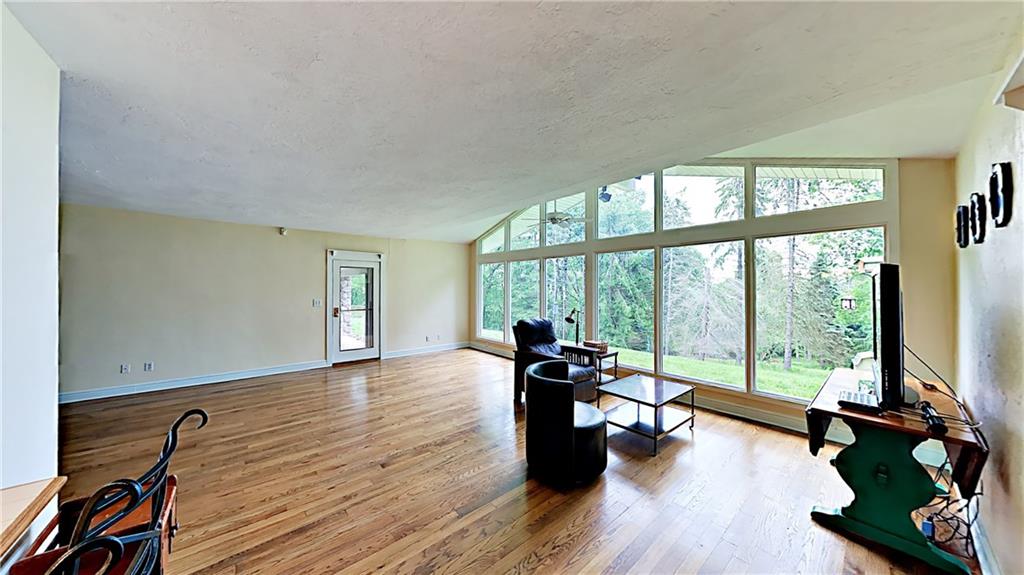 230 Highview Road Wexford, PA 15090 - Photo 10 of 25 Great room with hardwood flooring and wall of windows