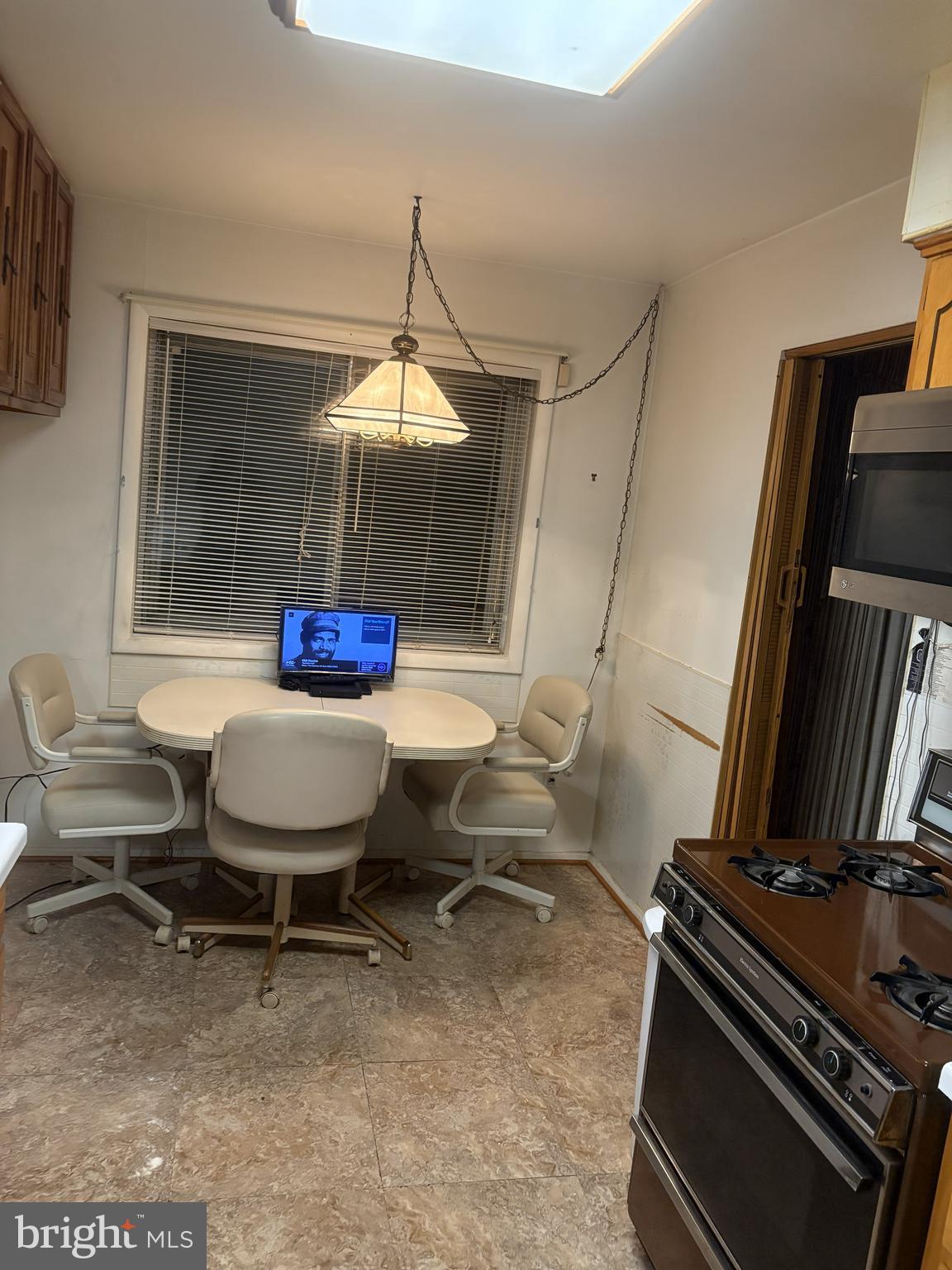 4523 Kinmount Road Lanham, MD 20706 - Photo 12 of 38 a living room with a couch and a table
