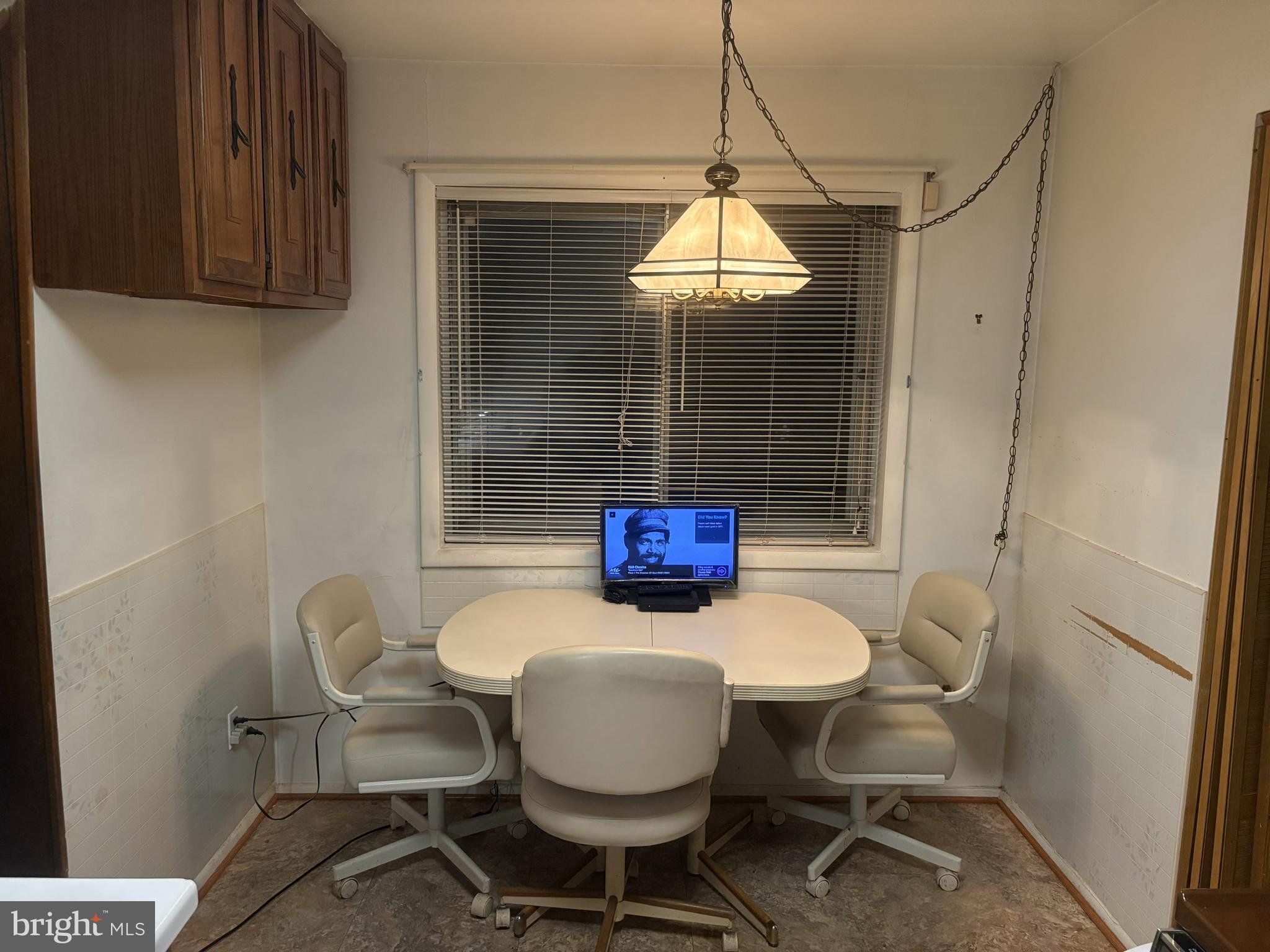 4523 Kinmount Road Lanham, MD 20706 - Photo 13 of 38 a view of a dining room with furniture and wooden floor